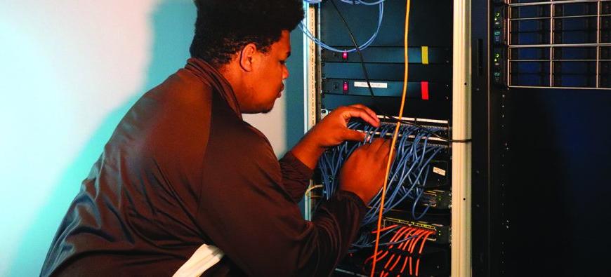 Student studying electrical panel